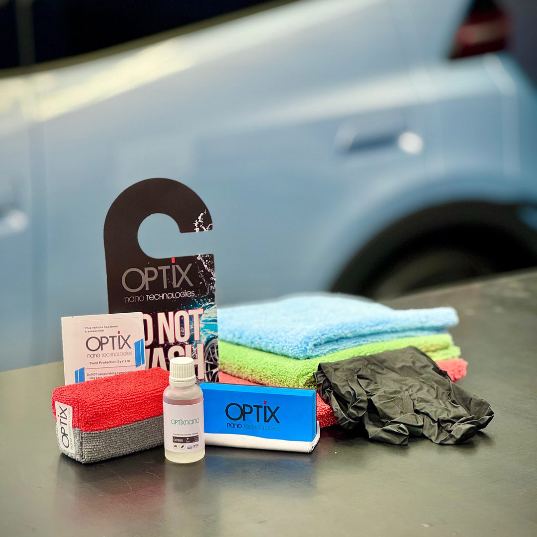 The Detail Warehouse OPTiX OP888 ceramic coating kit with 30ml bottle, applicators, microfiber towels, and gloves.