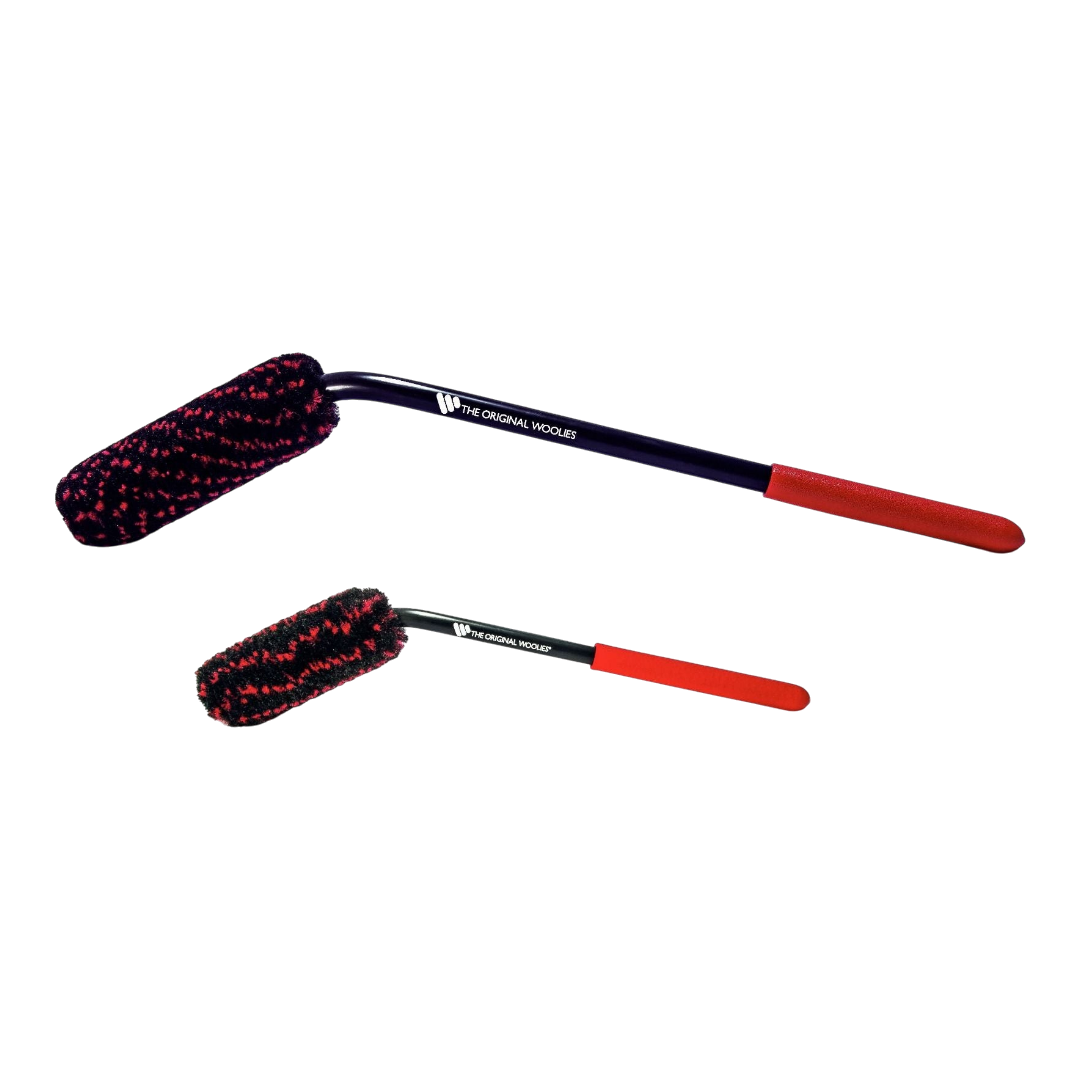 The Detail Warehouse Wheel Woolies angled rim brushes with red and black carpet fiber heads and rubber grip handles.