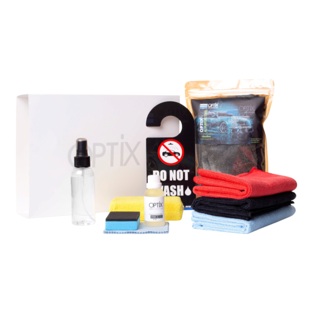 The Detail Warehouse OPTIX OP888 V2 ceramic coating deluxe kit with bottles, microfiber cloths, and applicator tools.