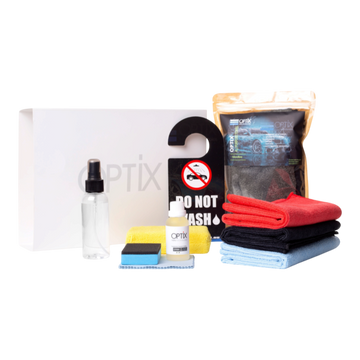 The Detail Warehouse OPTIX OP888 V2 ceramic coating deluxe kit with bottles, microfiber cloths, and applicator tools.