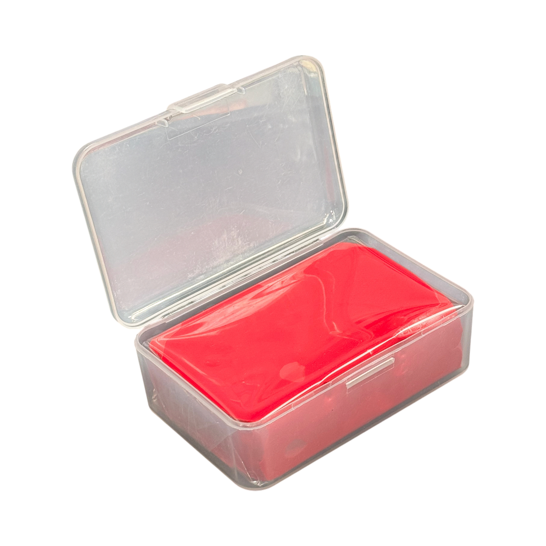 The Detail Warehouse red heavy duty clay bar for automotive paint decontamination, stored in a clear plastic case.