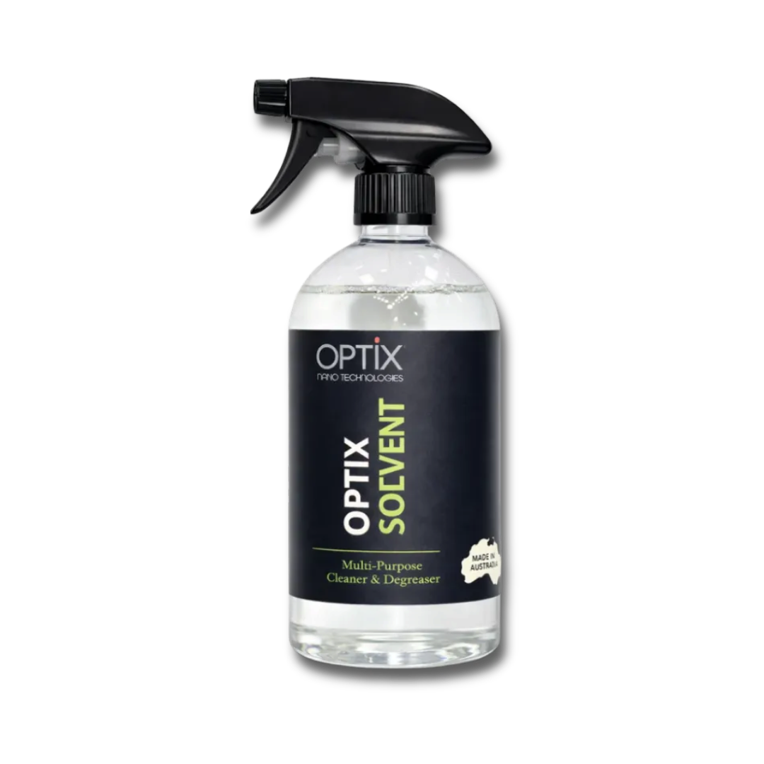 The Detail Warehouse OPTiX Solvent Cleaner in a clear spray bottle for removing tar, grease, and adhesive residue.
