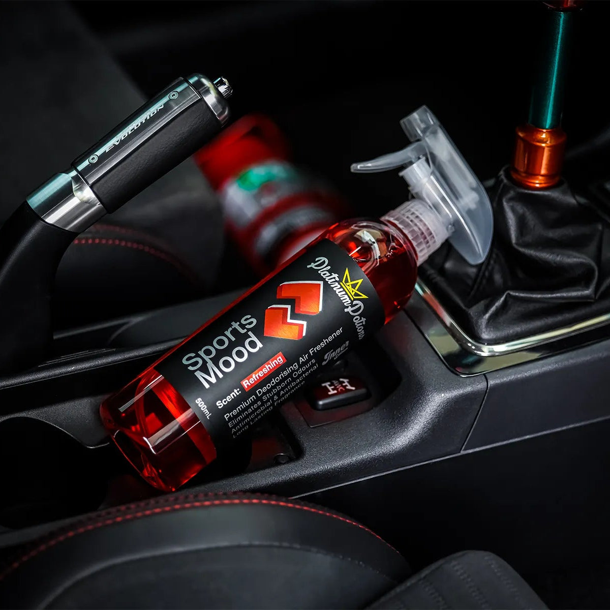 Bottle of sports drink in a car's gear shift area