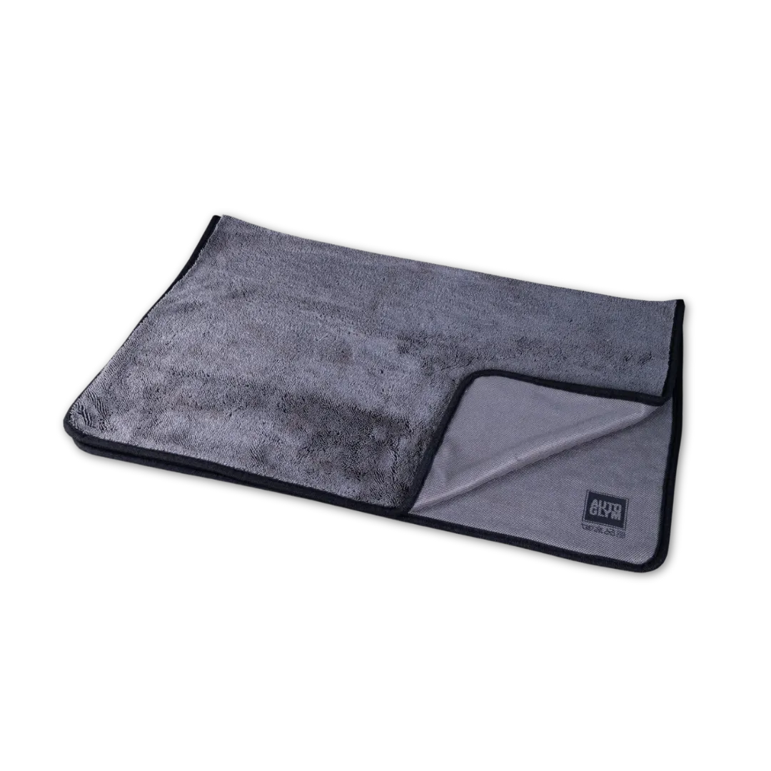 Gray towel with a brand logo on a white background
