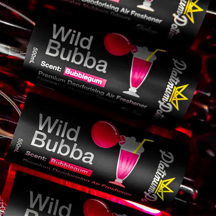 Multiple Wild Bubba Bubblegum air fresheners on a dark background