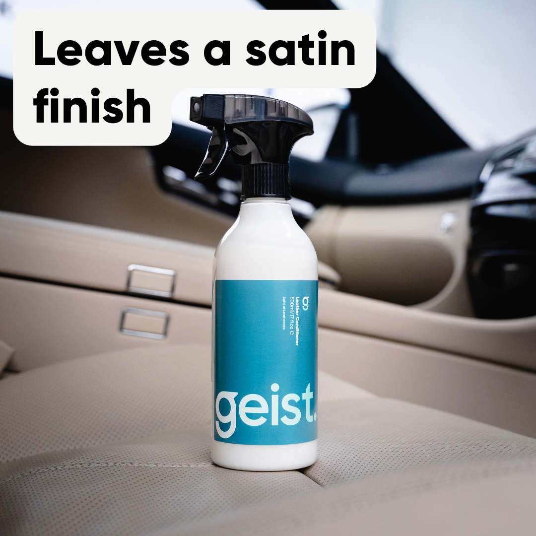 Spray bottle labeled 'geist' on a car interior with text about a satin finish.
