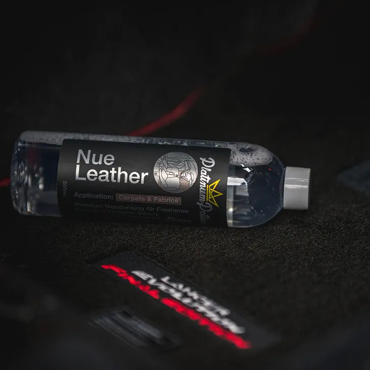 Nue Leather bottle on a car interior with 'Porsche' branding.