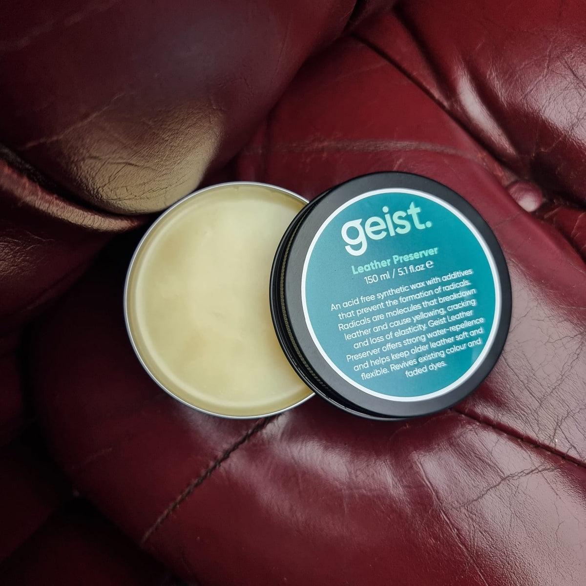 Geist leather preserver container on a leather surface