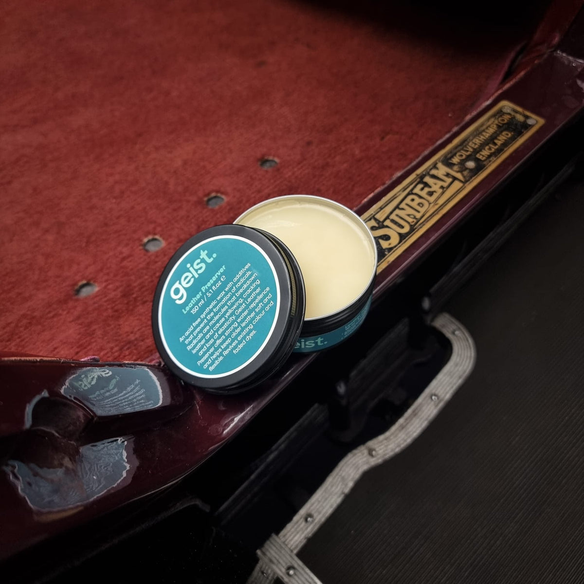 Geist leather wax container on a car interior with Sunbeam logo