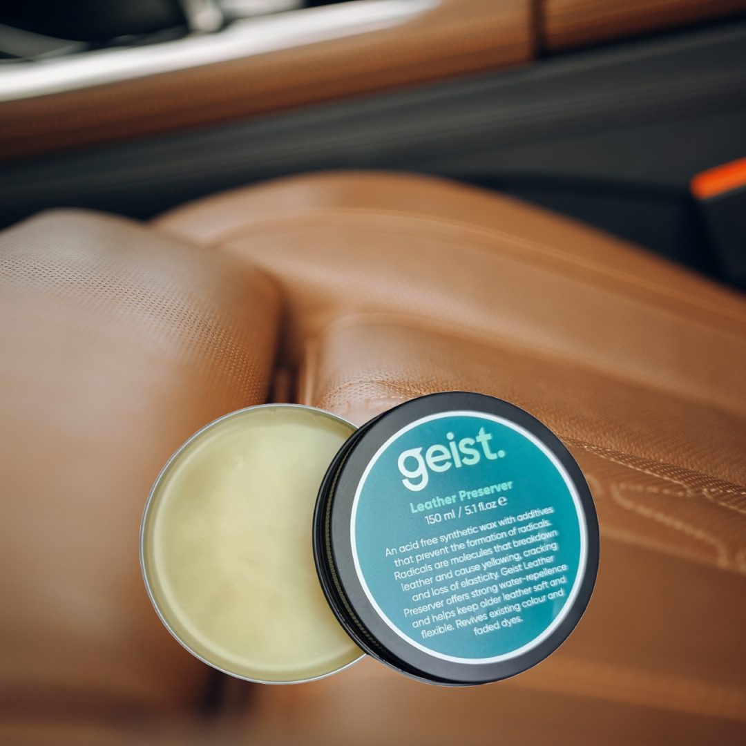 Geist leather préservative jar on a car seat