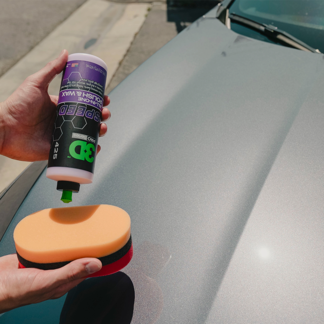 The Detail Warehouse 3D Speed all-in-one polish and wax bottle being applied to an orange foam applicator pad