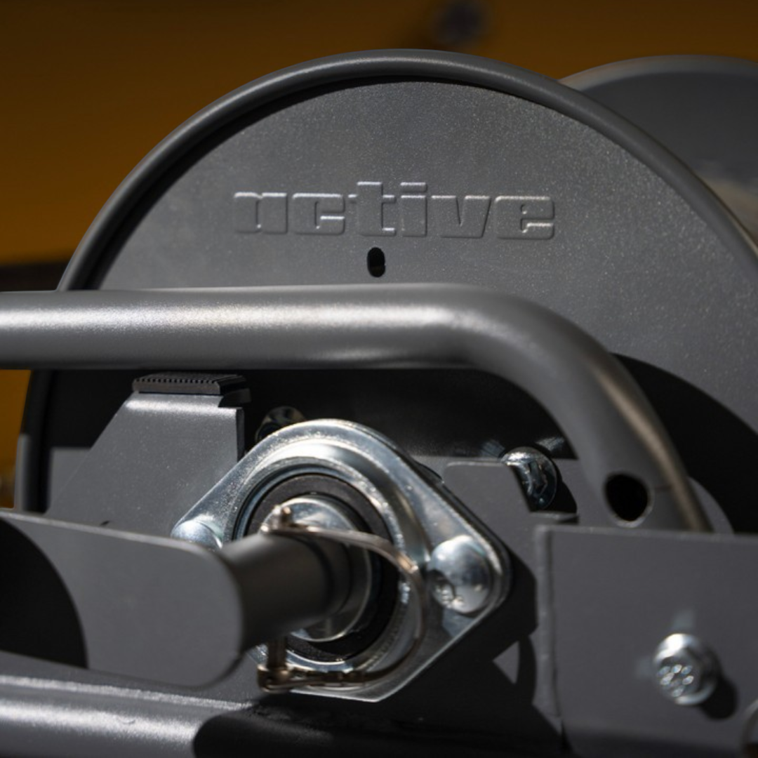 Close-up of The Detail Warehouse ACTIVE wash cart and hose reel featuring a durable grey metal frame and steel valve.