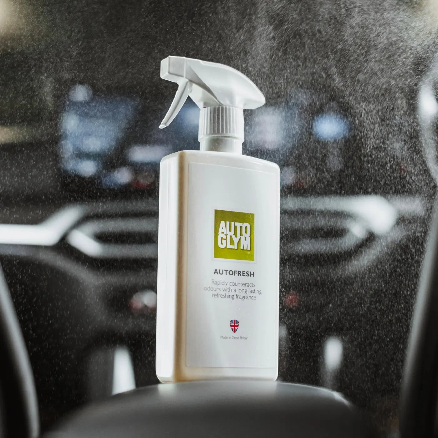 The Detail Warehouse Autoglym Autofresh interior air freshener spray bottle being used inside a car cabin