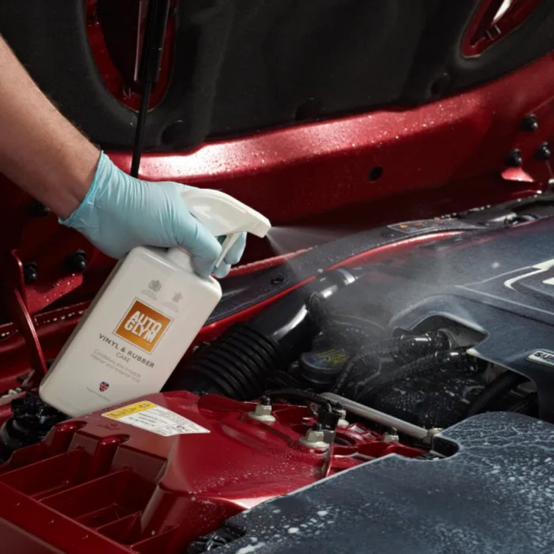 The Detail Warehouse Autoglym Vinyl & Rubber Care spray being applied to a car engine bay for protection