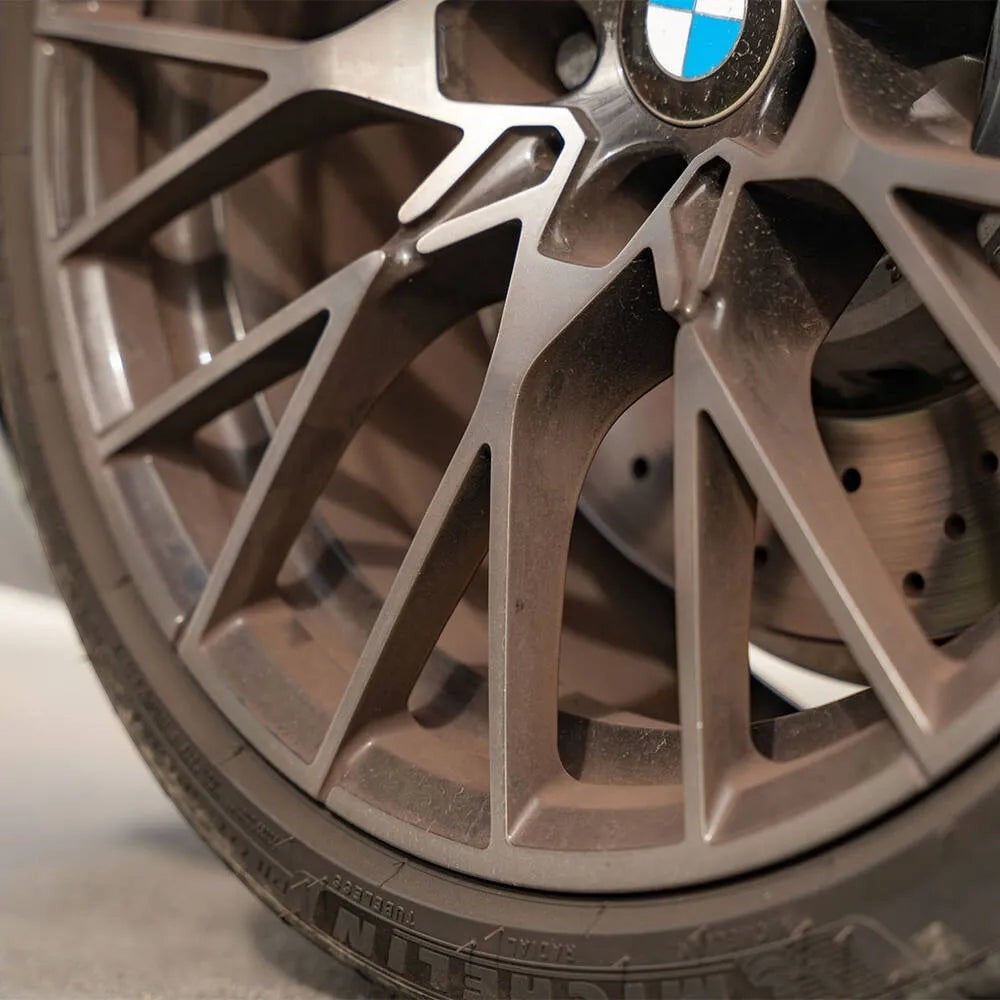 The Detail Warehouse Autoglym Advanced Wheel Cleaner applied to a dirty BMW alloy wheel showing brake dust accumulation
