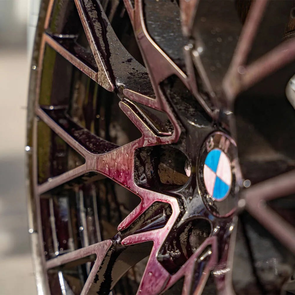 The Detail Warehouse Autoglym Advanced Wheel Cleaner turning purple while dissolving brake dust on a black alloy wheel
