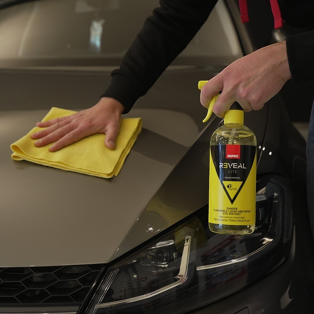 The Detail Warehouse presents Rupes Reveal Lite residue remover being applied to a car hood with a yellow microfiber