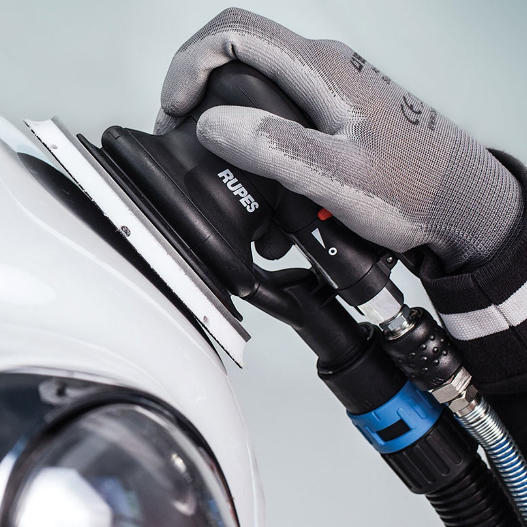 The Detail Warehouse Rupes RH359A Skorpio III pneumatic random orbital sander in use on a car panel