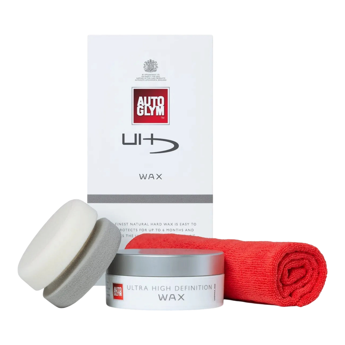 The Detail Warehouse Autoglym UHD Wax Kit featuring a 150g carnauba wax jar, foam applicator, and red finishing cloth.